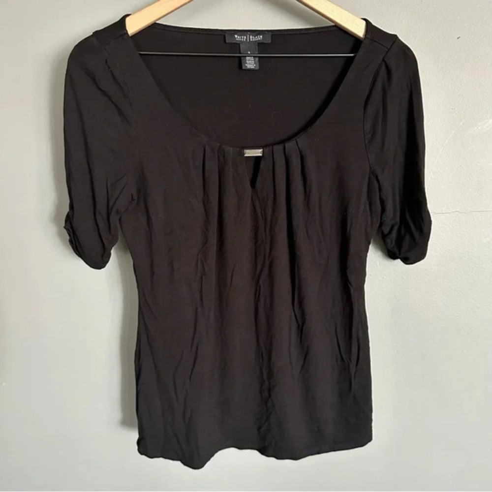 White House Black Market black top with silver buckle. Size Small